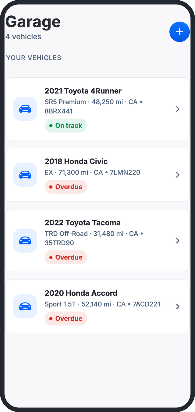 Garage screen listing four vehicles with maintenance status